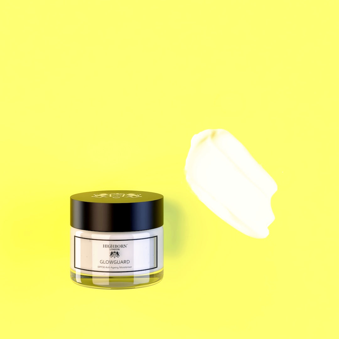 Highborn London GLOWGUARD SPF30 Anti-Ageing Moisturiser jar paired with a smooth white cream texture swatch on a bright yellow background